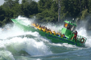 Green Boat in Rapids